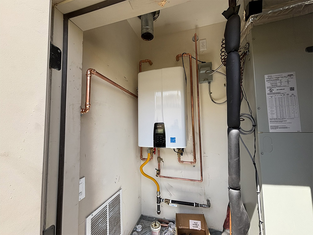 white tankless water heater mounted on the wall
